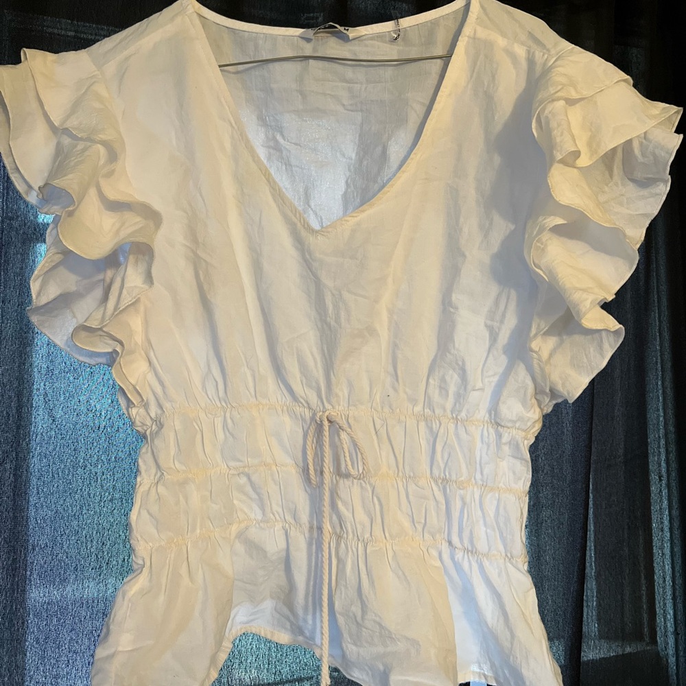 White ruffle blouse